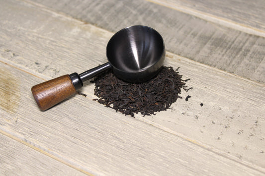 La cuillère Noir Cap sur le thé