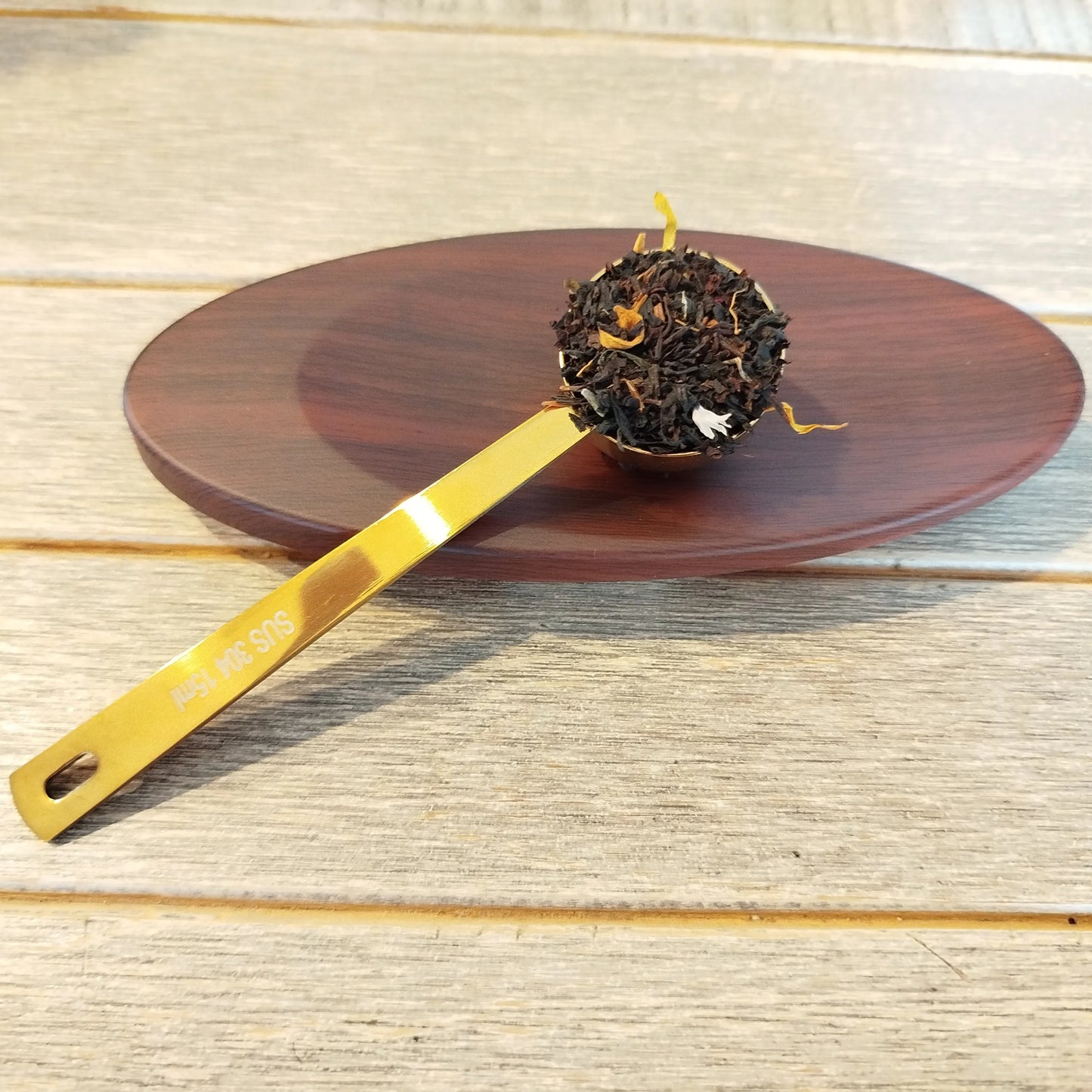 Cuillère doseuse à thé doré
